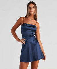 Satin V-neck A-line dress with criss-cross spaghetti straps.