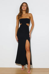 Slim-fitting black evening gown with side cutouts.