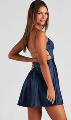 Satin V-neck A-line dress with criss-cross spaghetti straps.