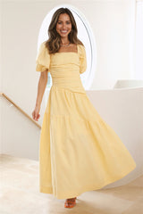 Yellow puff-sleeved, fitted midi dress