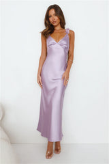 Parties In Spring: A soft pink satin maxi dress – a show-stopping outfit for parties.